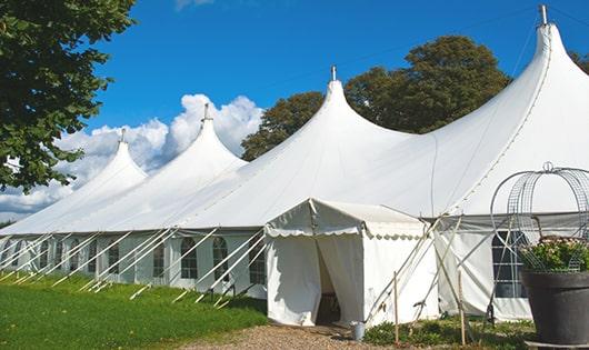 a line of portable restrooms in a shaded area, offering a comfortable experience for users in Middlefield CT